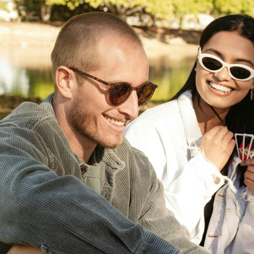 Woman and man wearing sunglasses
